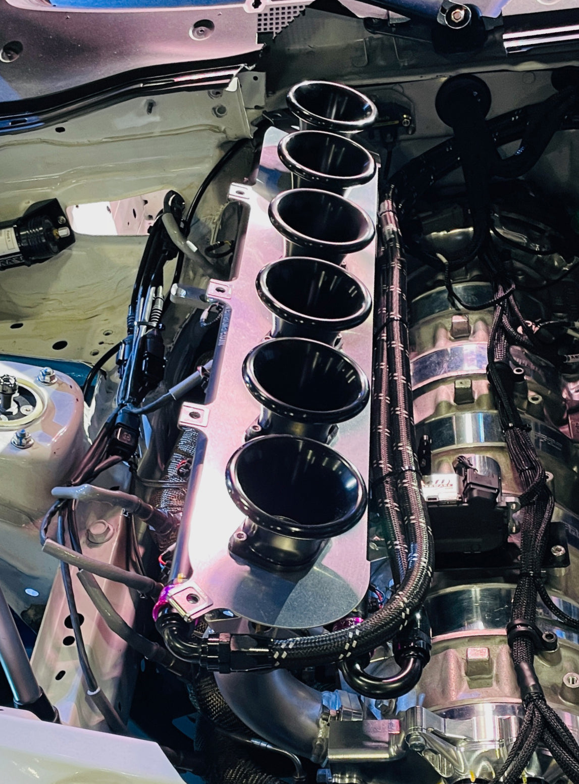 High-performance engine bay with Dyme E85 hoses installed.